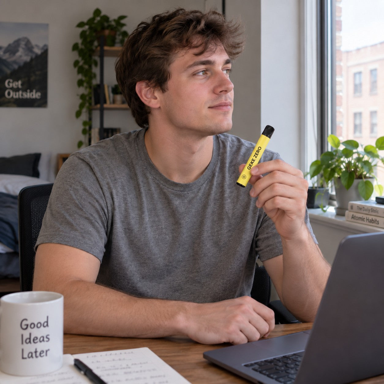 Illustrative scene: Young adult man holding the yellow Sea Salt Lemon stick at his home desk